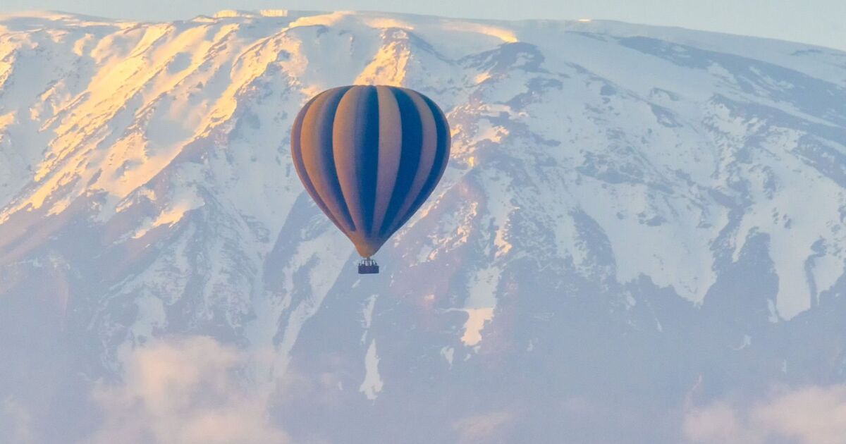 A man has died after falling from hot air balloon in a UK village