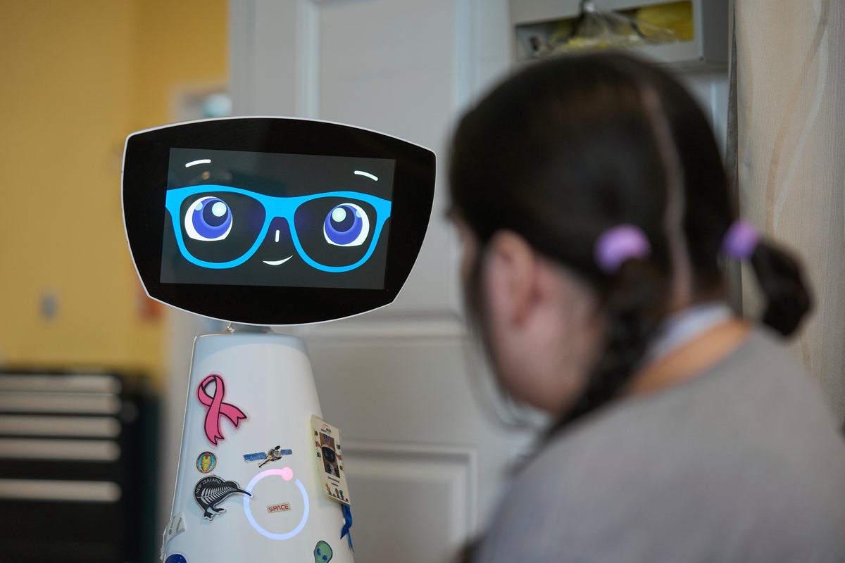 A robot programmed to act like a 7-year-old girl works to combat fear and loneliness in hospitals