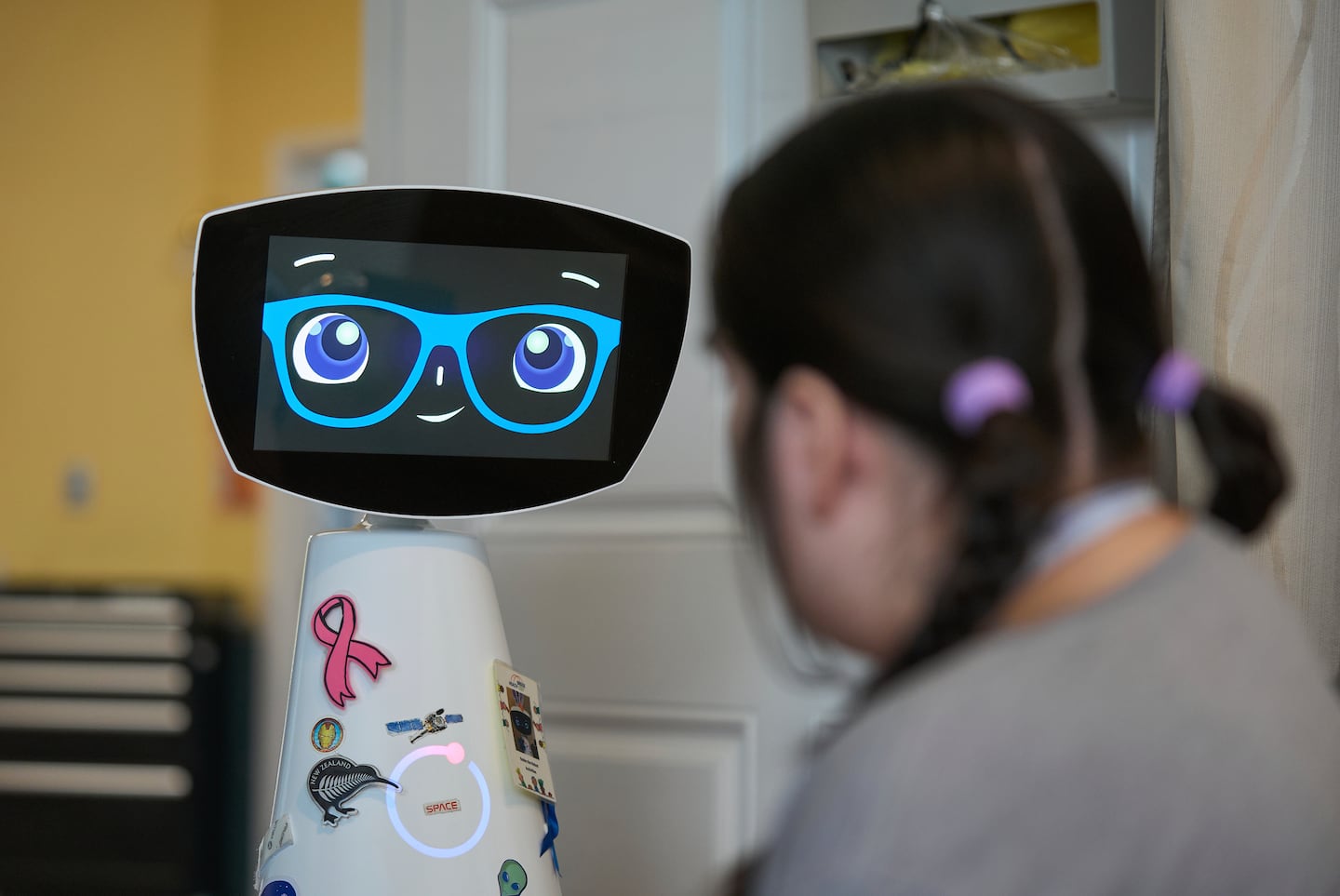 A robot programmed to act like a 7-year-old girl works to combat fear and loneliness in hospitals - The Boston Globe