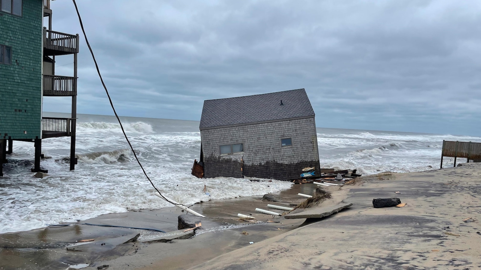 Another beachfront stilt house collapses into the surf on the Outer Banks