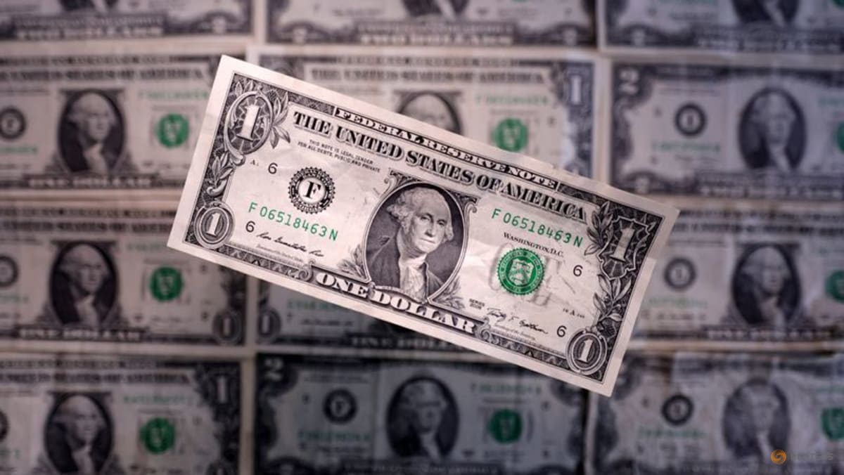 Dollar edges up from four-year low versus euro as traders await Fed decision