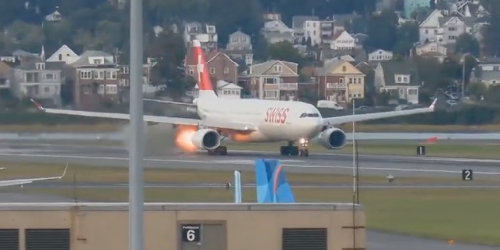 Flight departing from Boston puts on the brakes after spitting out flames