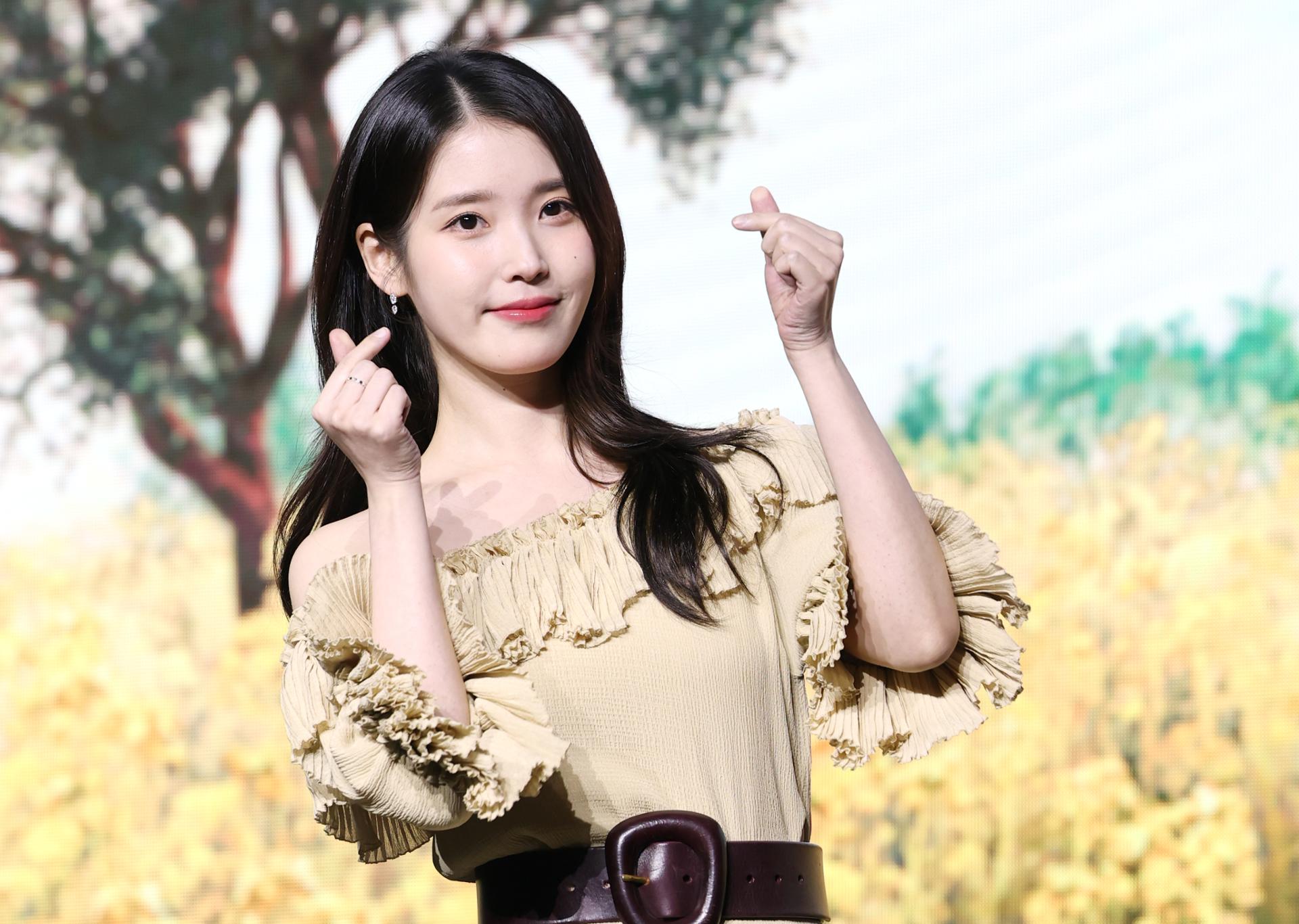 IU donates 200 mil. won to mark debut anniversary - The Korea Times
