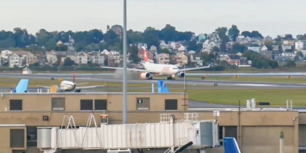 Passenger jet aborts Boston takeoff after flame and smoke spew from engine