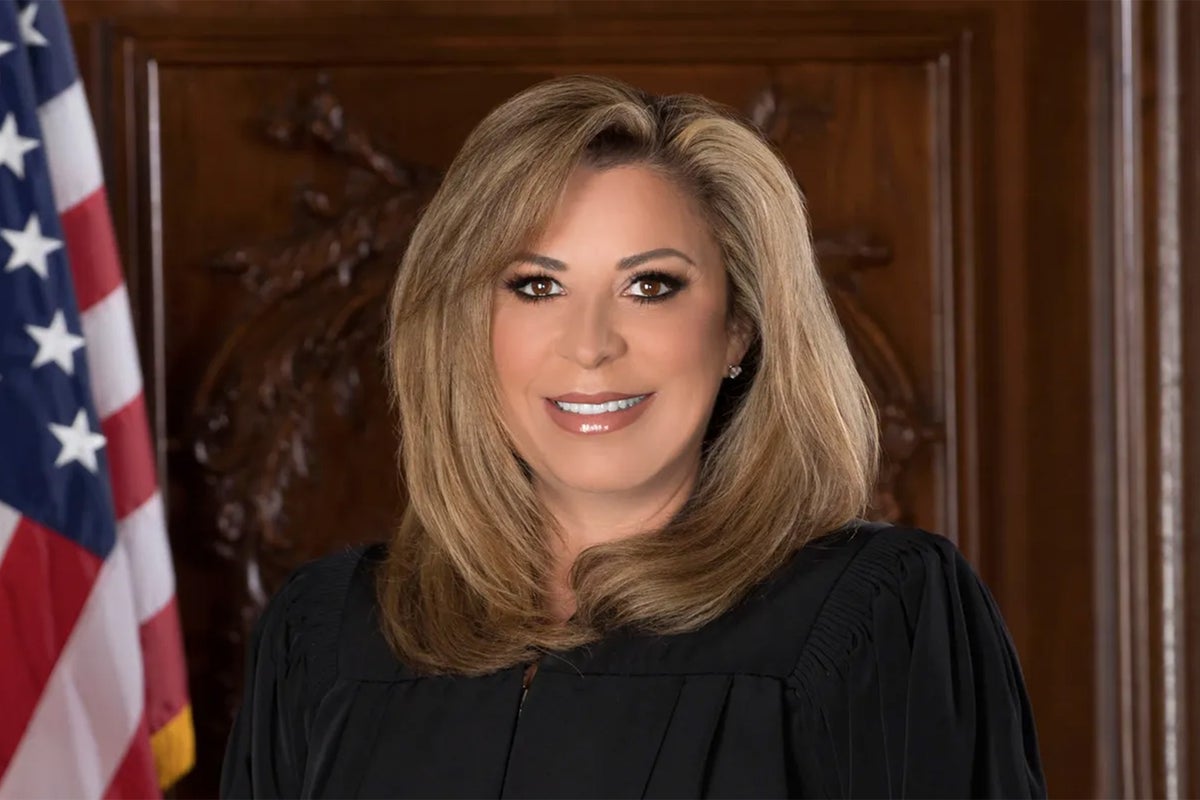 Retired judge sues bottled water company saying it poisoned her husband