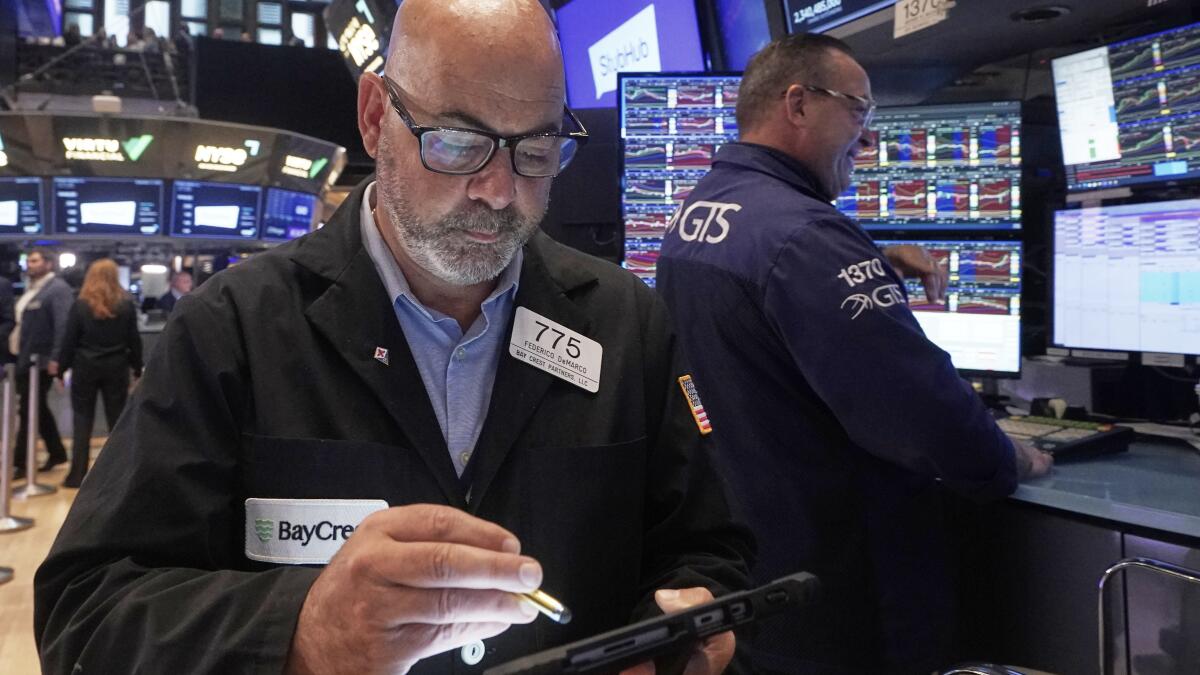 Stocks churn amid uncertainty about how many more rate cuts are coming from the Fed