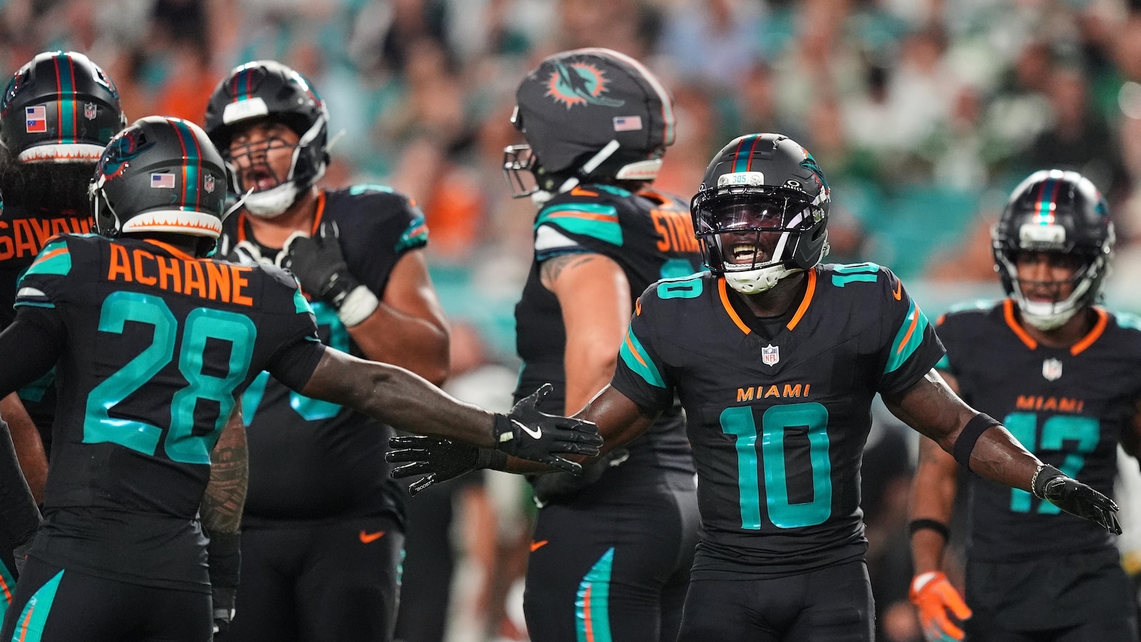 Dolphins' Tyreek Hill carted off field and taken to hospital with dislocated left knee