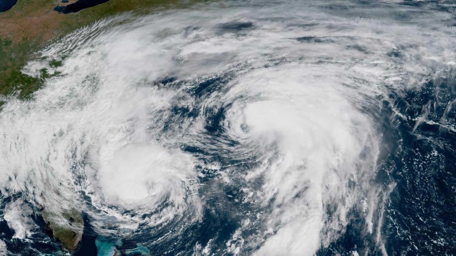 Bermuda lashed by distant hurricane and prepares for the stronger Imelda