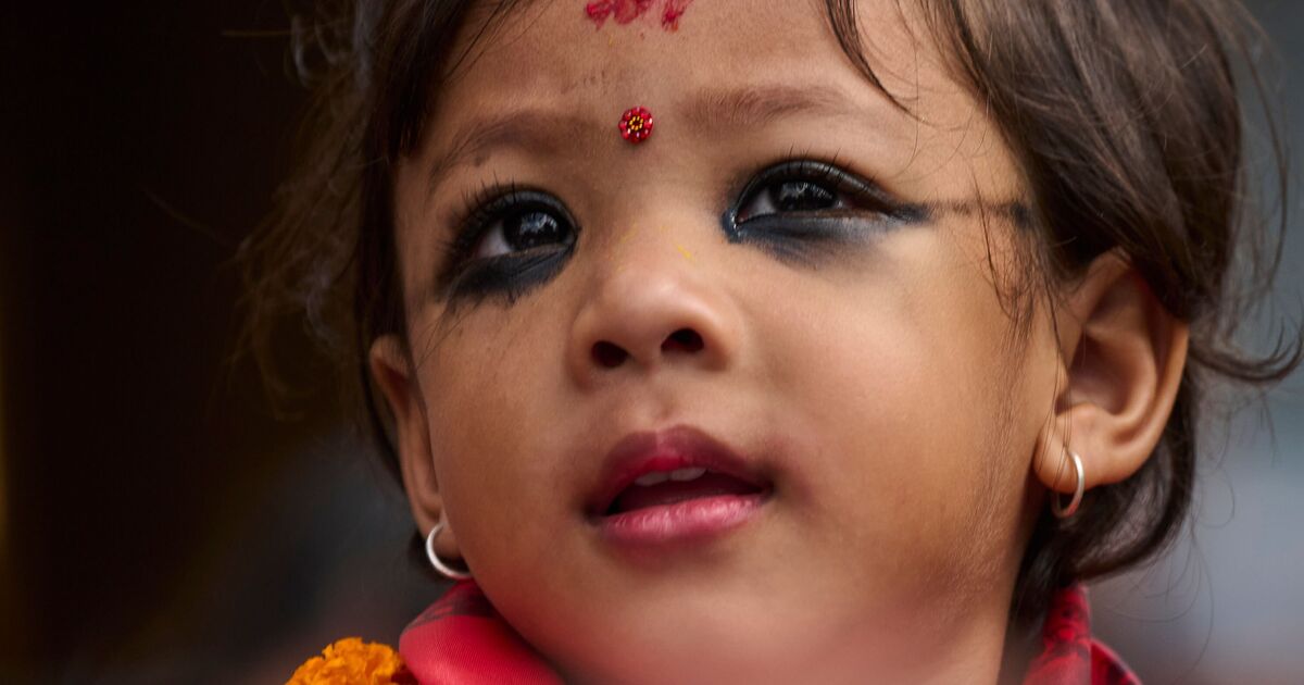 Worshippers queue to touch feet of two-year-old girl paraded as 'goddess'