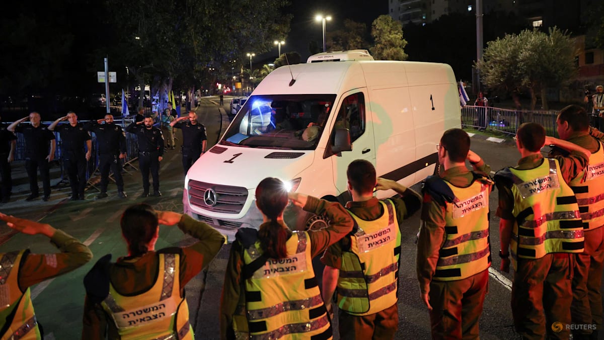 Hamas hands over hostage bodies after Israel threatens aid cut