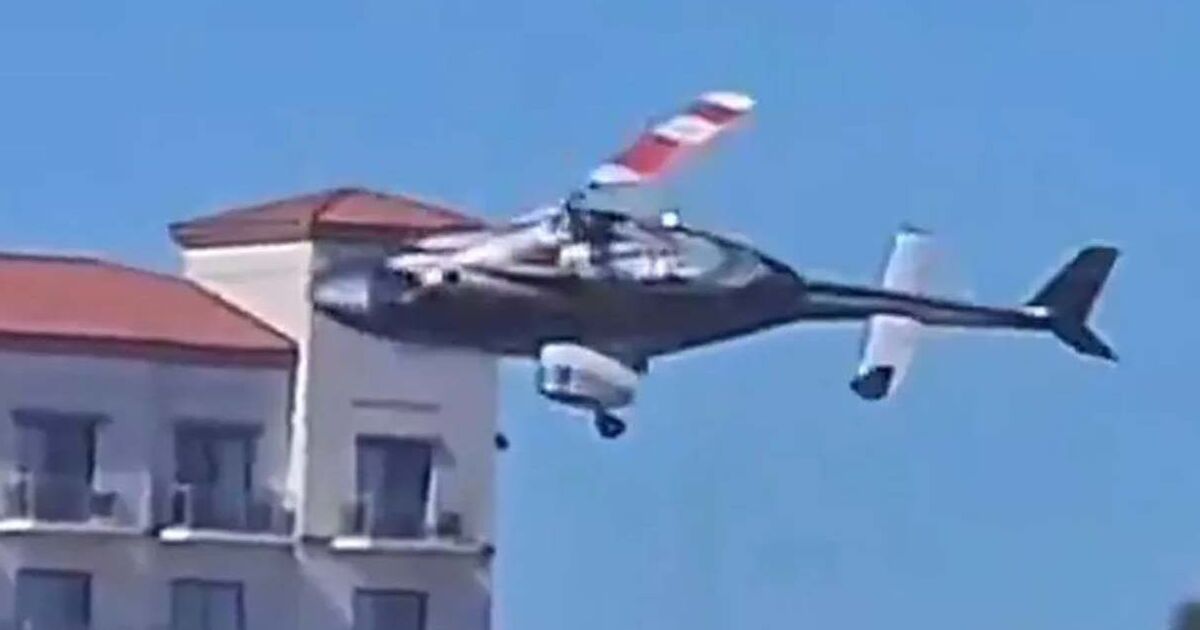 Helicopter crash horror as aircraft spirals out of control onto beach