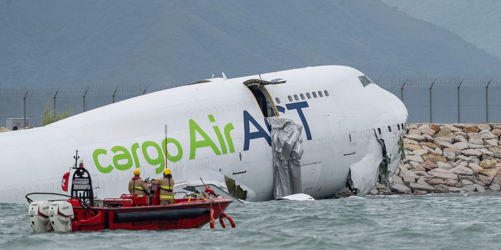 Two ground staff killed at Hong Kong airport after cargo plane and vehicle go into the sea