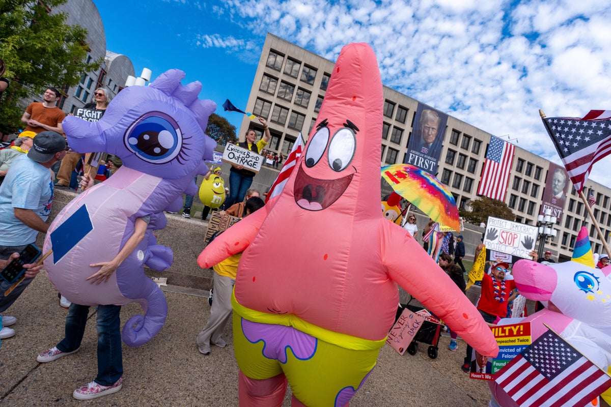 Inflatable costumes used to deflate tensions at rallies against Trump, in photos