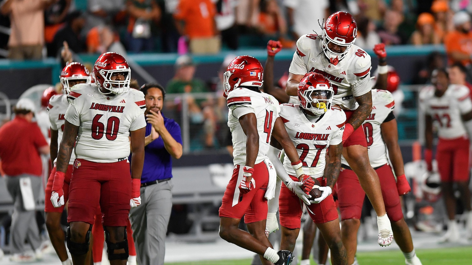 Louisville intercepts 4 of Beck's passes, tops No. 2 Miami 24-21 to end Hurricanes' home streak