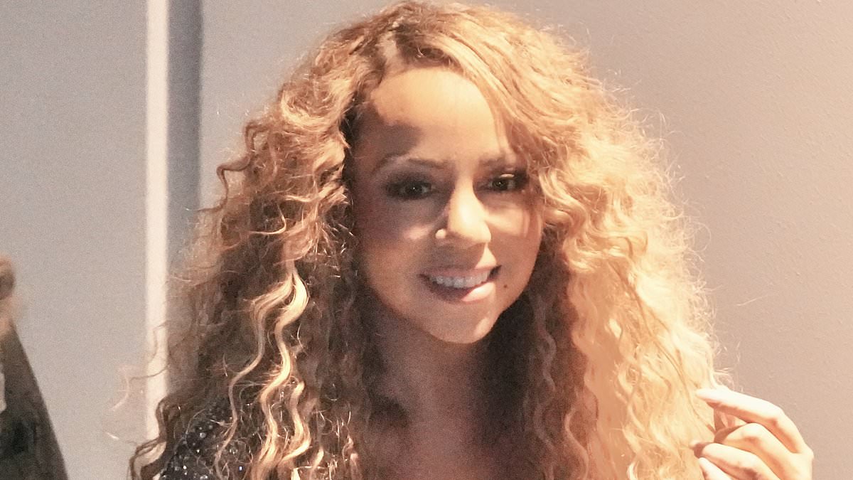 Mariah Carey shows off her physique as she performs in Australia