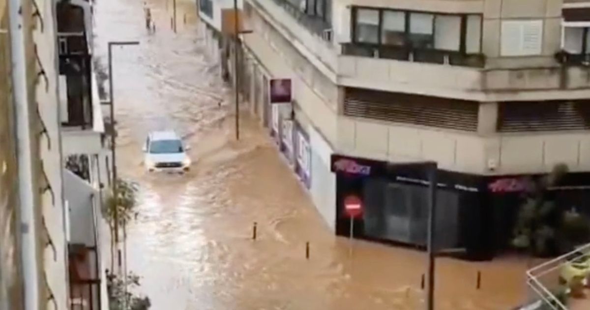 Massive floods rip through Spanish streets with cars swept away and trains cancelled - The Mirror