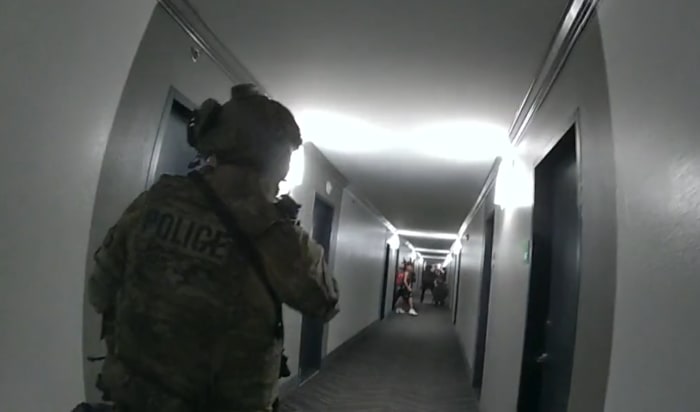 'I'm not dressed:' SWAT officers evacuate hotel guests before killing fugitive