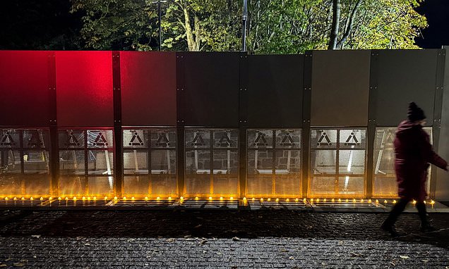 Protesters let off pink smoke during asylum demonstration at Citywest