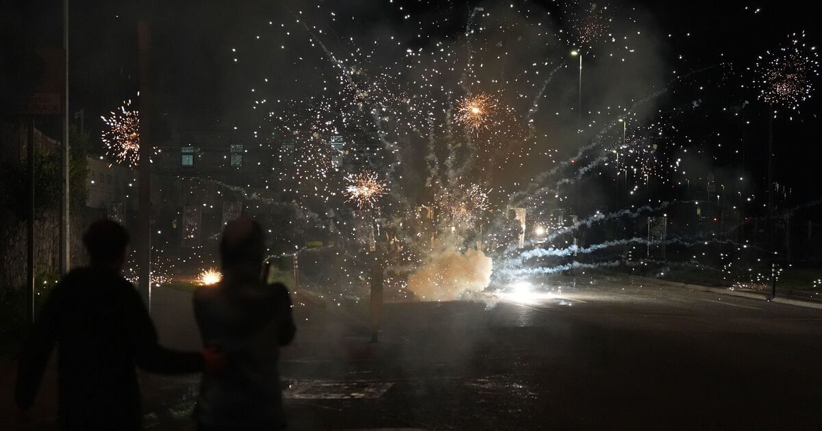 Moment violent protesters clash with police outside asylum hotel