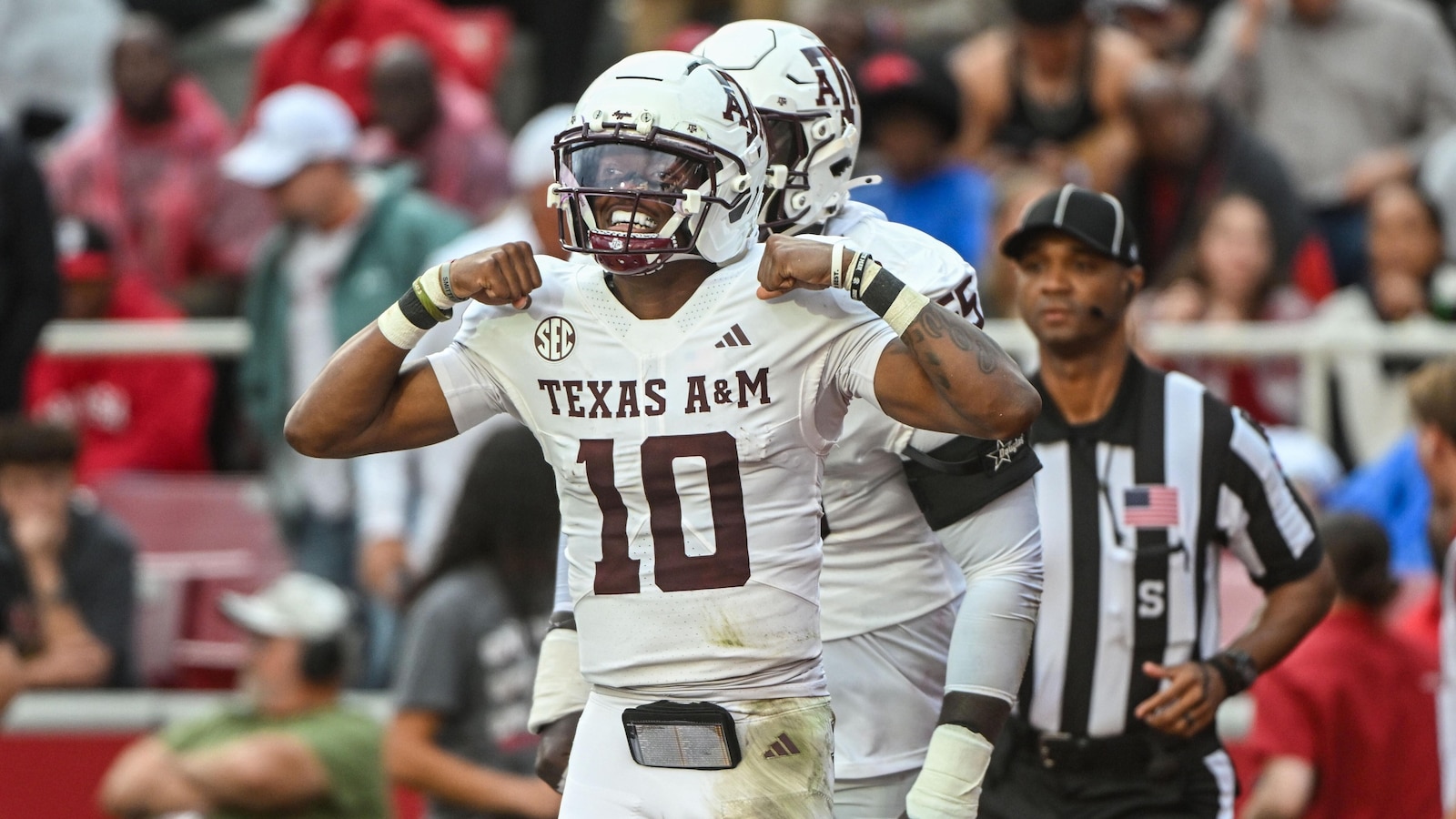 Reed throws for 280 yards and 3 TDs, runs for another score as No. 4 Texas A&M beats Arkansas 45-42