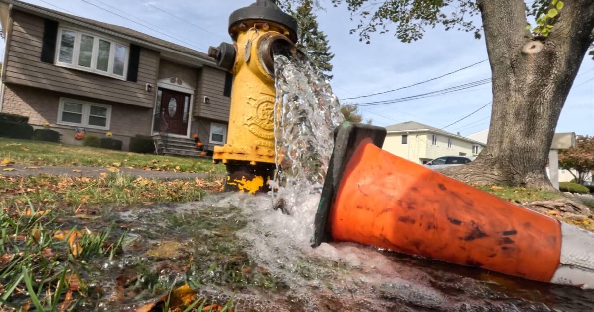 Water main break in Waltham, Massachusetts leaves car submerged and home's basement flooded
