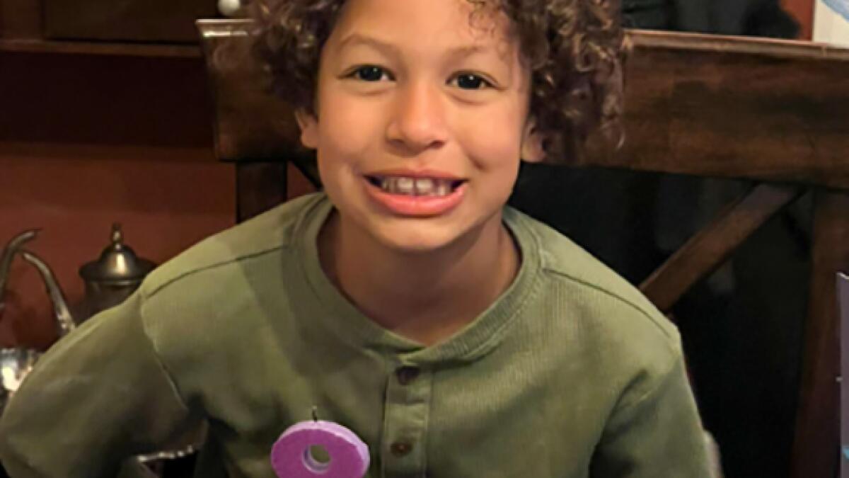 Boy, 8, killed by tree branch at camp. Parents say it wasn't an 'act of nature' and are suing