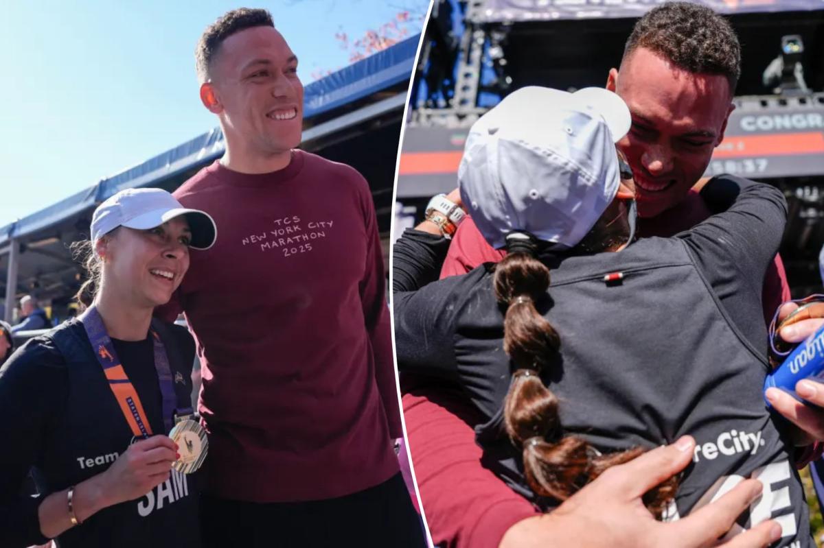 Aaron Judge hugs wife Samantha after she completes 2025 NYC Marathon