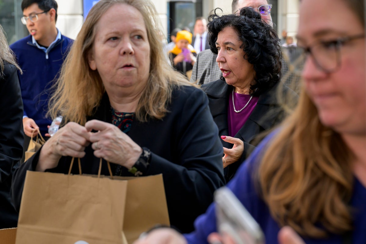 Photos of Americans turning to food pantries as shutdown drags on