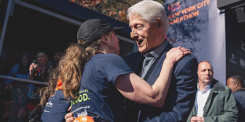 Bill Clinton spotted at NYC Marathon with bandaged nose while cheering on daughter Chelsea