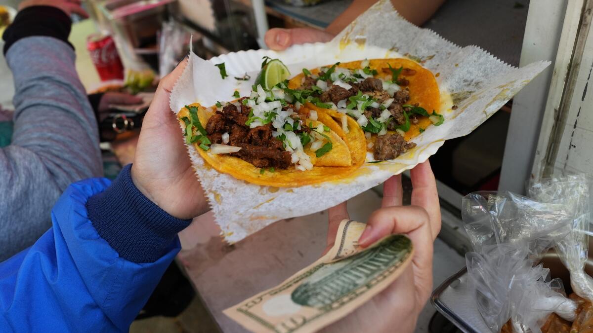 'A day without fear': Chicagoans buy out street vendors amid immigration crackdown