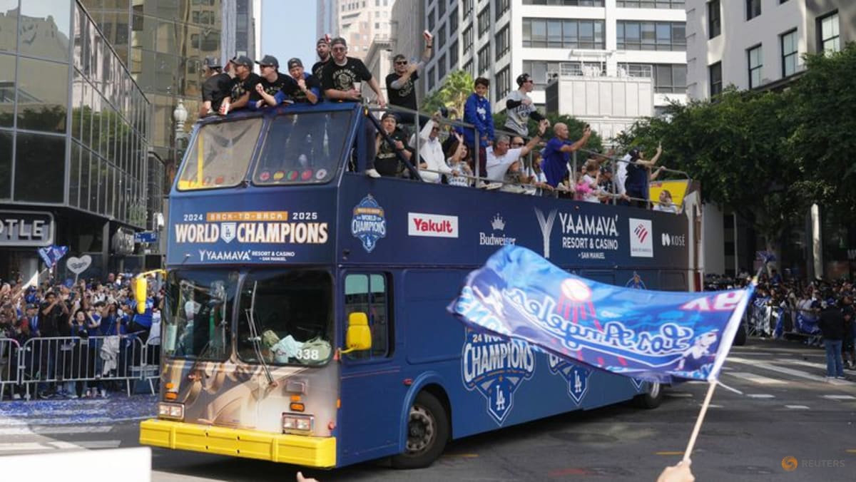 Baseball-Ohtani teases 'three-peat' as Dodgers parade draws Los Angeles crowds