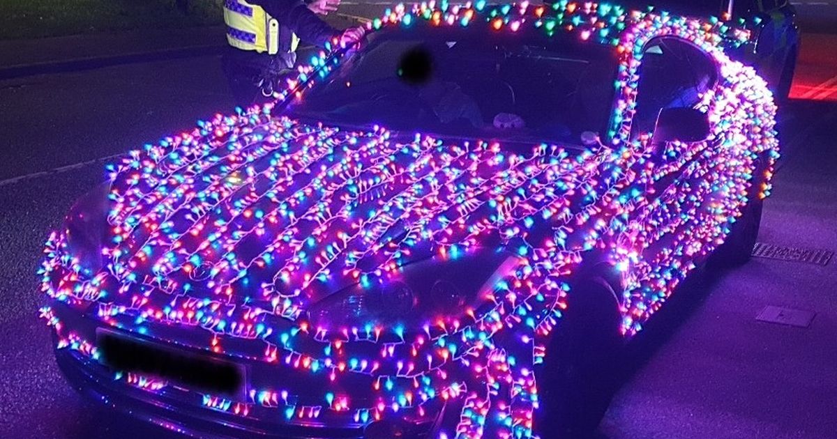 Driver with Christmas lights on car pulled over by police and faces fine - The Mirror