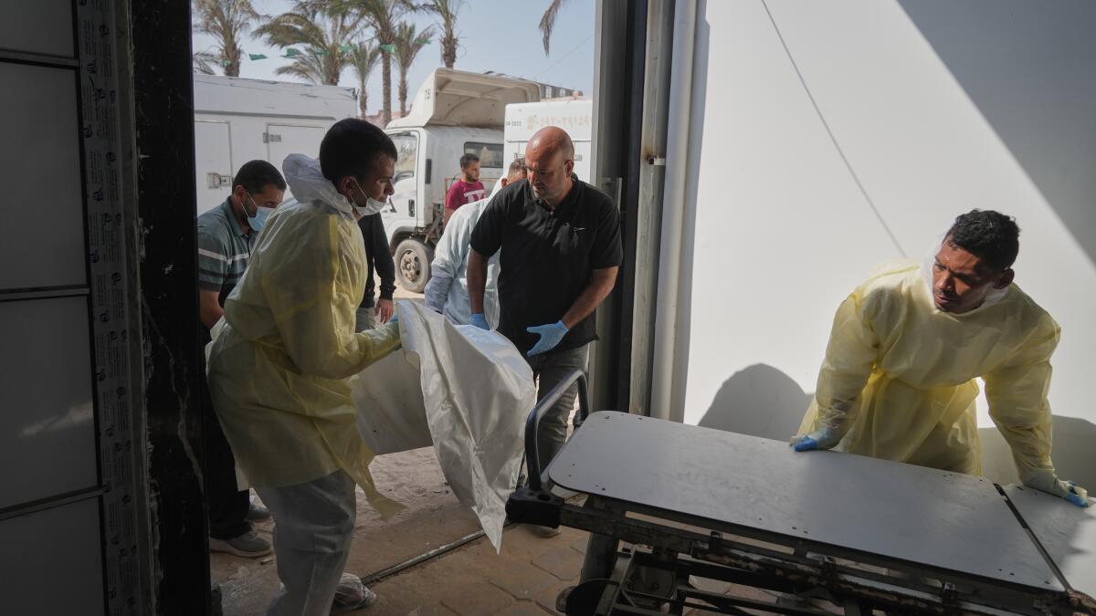 Israel returns bodies of 15 Palestinians to Gaza as exchanges in fragile ceasefire continue