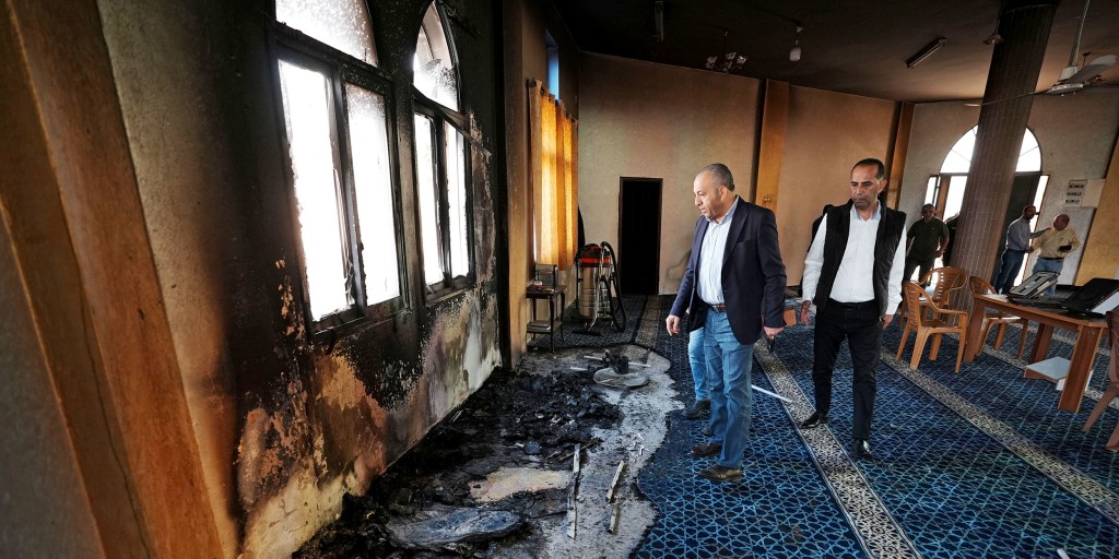 Israeli settlers torch West Bank mosque and scrawl hateful messages after military condemnation