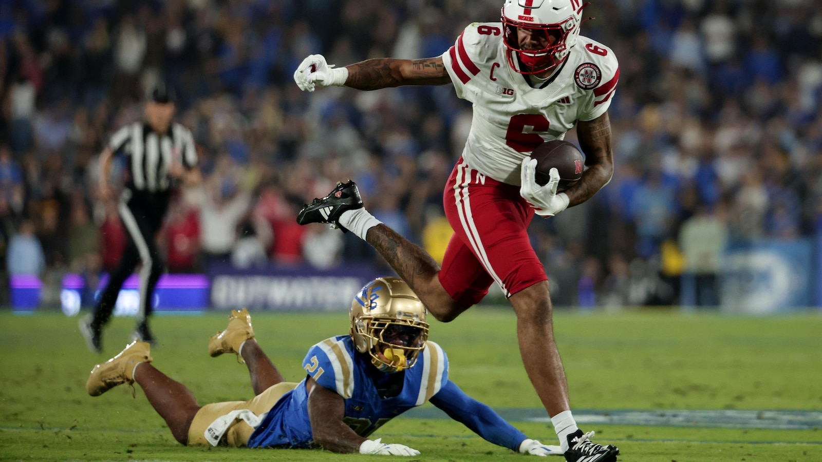 Lateef's impressive debut as a starter and Johnson's rushing lead Nebraska over UCLA 28-21