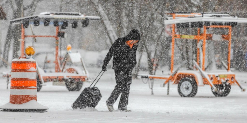 Winter storm wallops parts of Midwest on one of the biggest travel days of the year