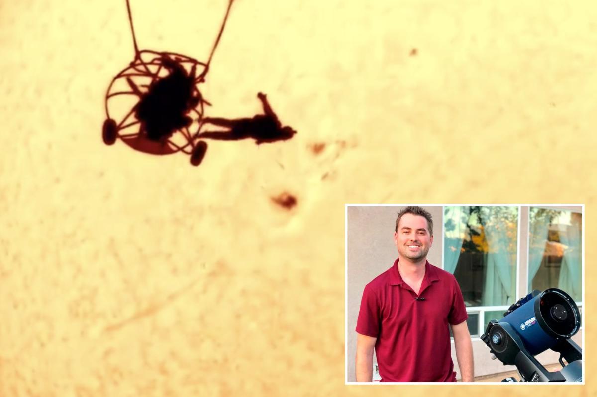Photographer captures skydiver silhouetted against sun in stunning...