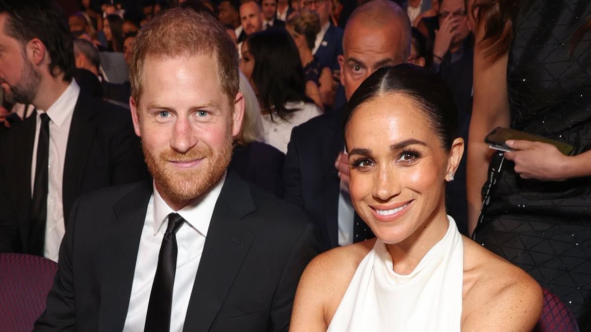 Prince Harry and Meghan Markle pose with celebrity psychic
