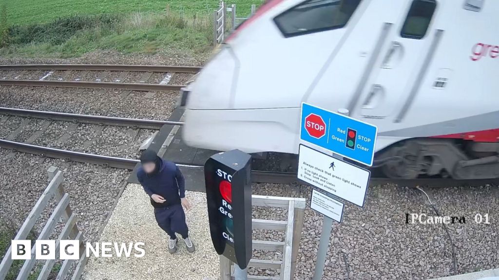 Teenager's near-miss with train caught on video at Diss crossing