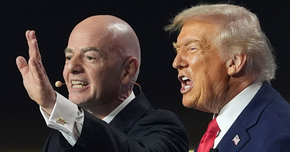 Donald Trump's bizarre hidden signal as 'fanboy' FIFA president hands him peace prize - The Mirror