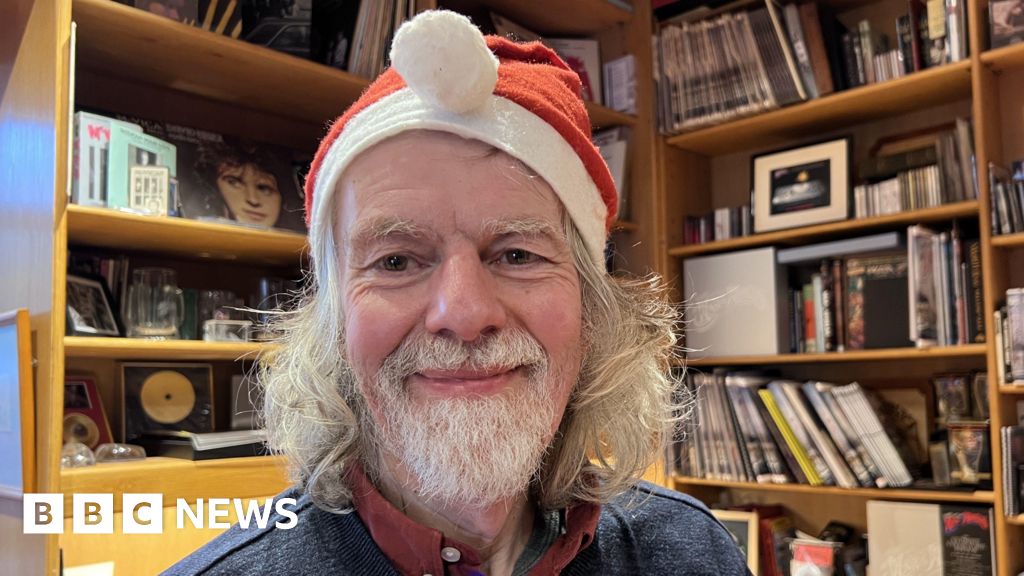 Mr John Lewis records his Christmas song in Hertfordshire studio