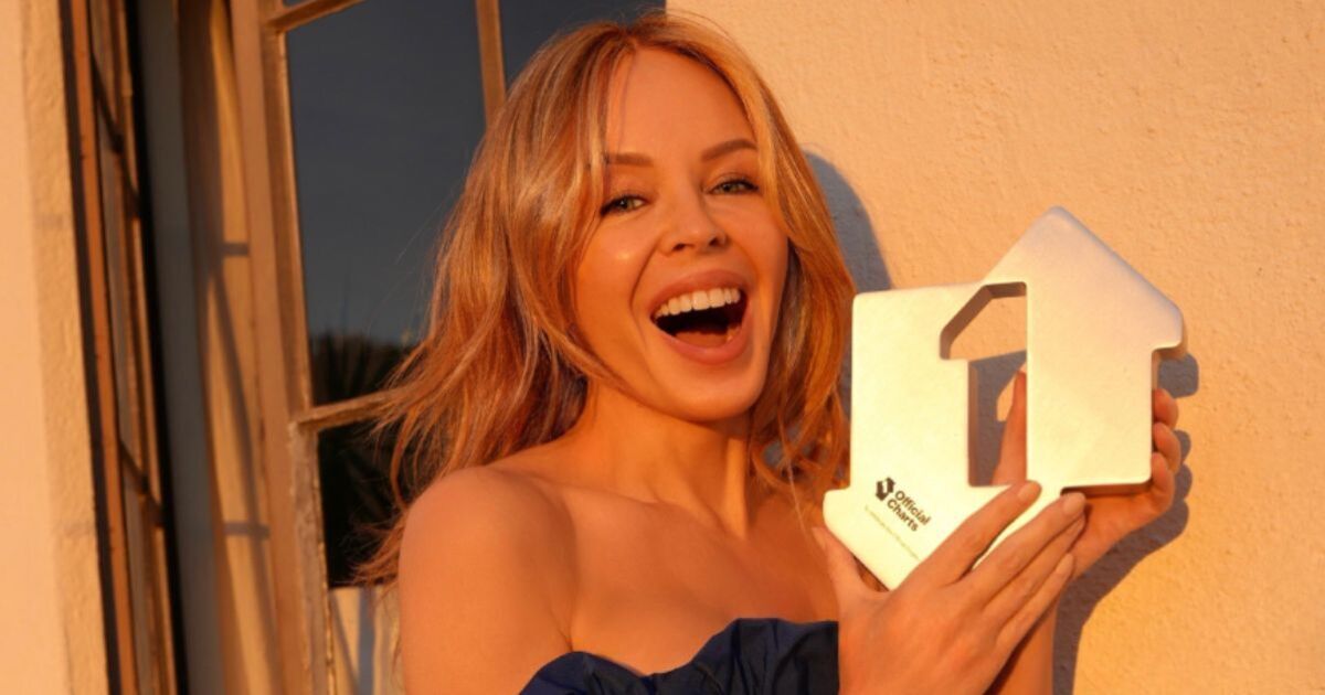 Christmas number one bombshell announced as star poses with trophy