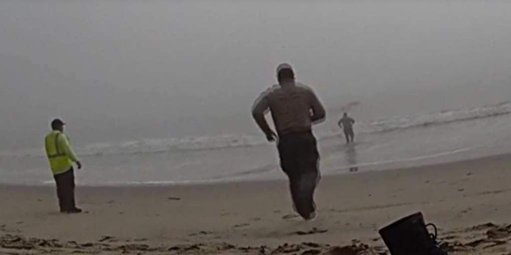 LA deputies caught on camera racing into foggy ocean to rescue disoriented paragliders