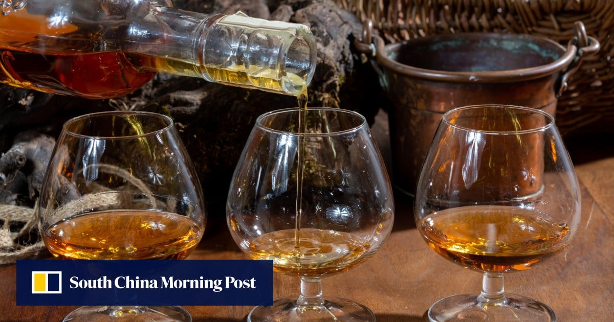 Malaysia arrests 2 over video of man in headscarf drinking alcohol