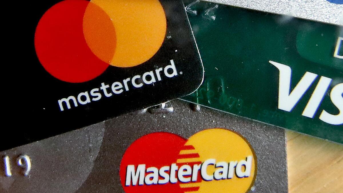 Contributor: They're coming for your credit card, from the left and right