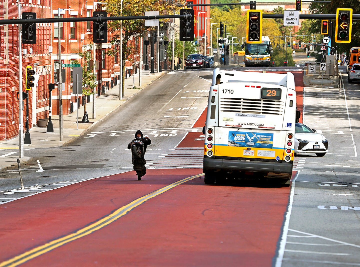 Years ago, Boston put bus lanes in the middle of this busy street. Has it worked? - The Boston Globe