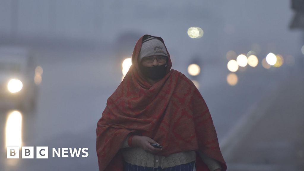 In pictures: Fog and frozen lakes as cold wave sweeps northern India