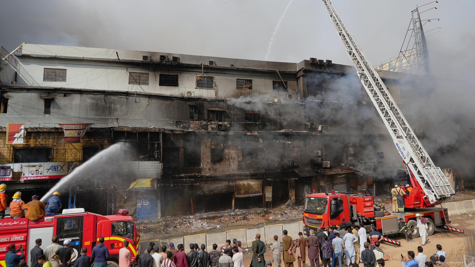 Death toll in Karachi shopping plaza fire rises to 10 as search continues for dozens missing