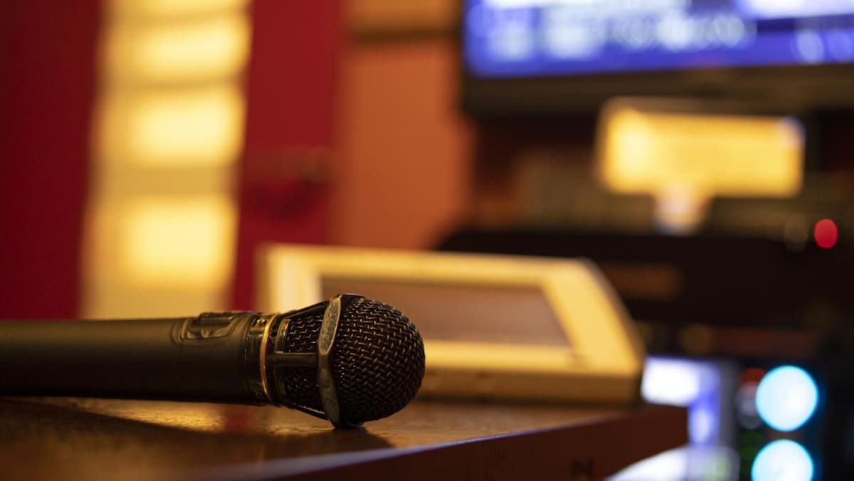 Karaoke lounge owner fined for unlicensed use of Chinese pop songs after prosecution by music licensing body