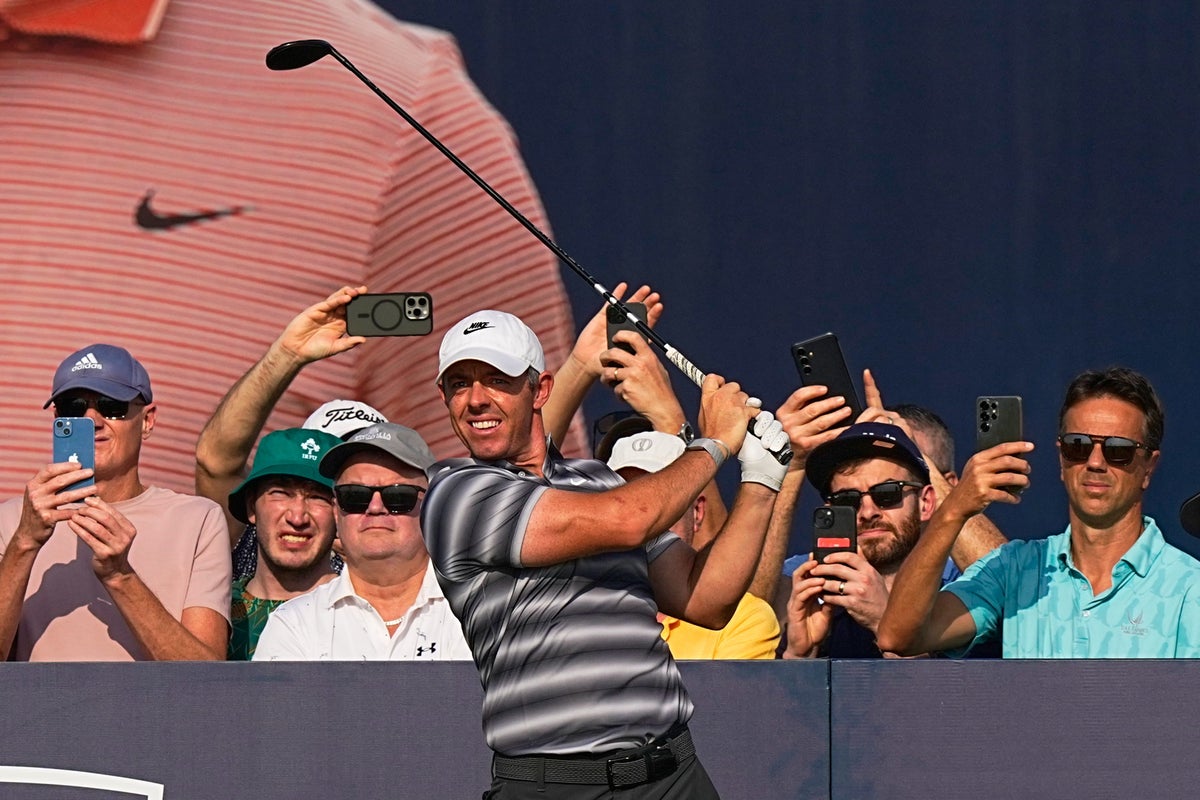 Rory McIlroy gets to grips with new clubs to take first-round lead in Dubai